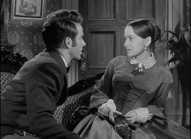 Catherine (Olivia de Havilland) is initially uneasy about Morris (Montgomery Clift)'s attentions in William Wyler's The Heiress (1949)