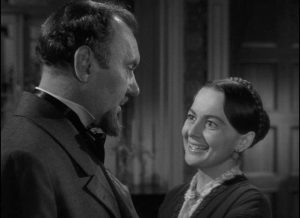 Catherine (Olivia de Havilland) tries to please her demanding father (Ralph Richardson) in William Wyler's The Heiress (1949)