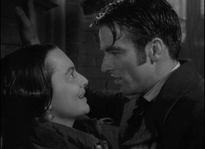 Morris (Montgomery Clift) imposes on Catherine (Olivia de Havilland)'s space as he courts her ... but she learns to resist his temptation in William Wyler's The Heiress (1949)