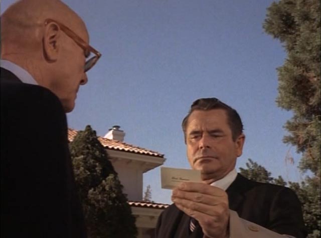 Prof. Andrew Patterson (Glenn Ford) receives instructions from his mentor Chad Harmon (Dean Jagger) in Paul Wendkos' The Brotherhood of the Bell (1970)