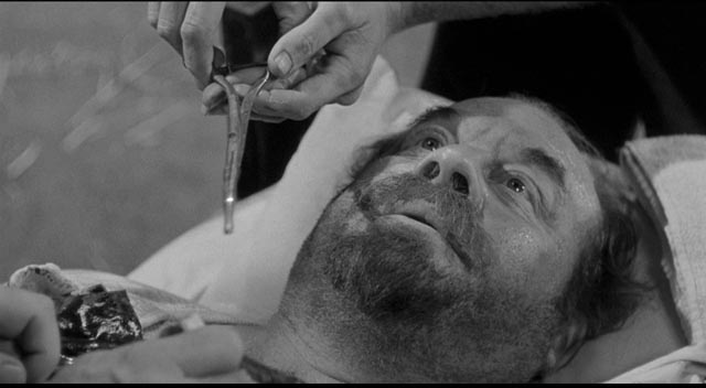 Bruhn (Burl Ives) has a bullet removed by the local doctor/vet in Andre de Toth's Day of the Outlaw (1959)
