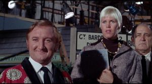 June (Beryl Reid)'s co-workers (Ronald Fraser and Rosalie Williams) enjoy witnessing her decline in Robert Aldrich's The Killing of Sister George (1968)