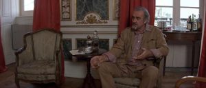 Barley (Sean Connery) is interrogated by British intelligence about his Russian connections in Fred Schepisi's The Russia House (1990)