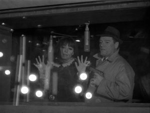 Natacha von Braun (Anna Karina) and Lemmy Caution (Eddie Constantine), by being human, cause the computer to self-destruct in Jean-Luc Godard's Alphaville (1965)