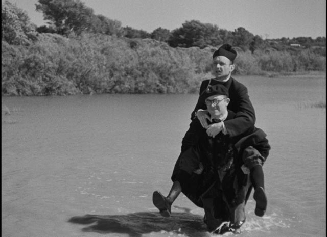 The Leftist teacher (Robert Bassac) and the Priest (Robert Vattier) set aside their differences in order to restore social order in Marcel Pagnol's The Baker's Wife (1938)