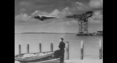 Heathley (James Donald) and Brian (Patric Doonan) take the M-7 up for a test flight without authorization in Anthony Asquith's The Net (1953)