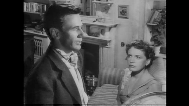 Michael Heathley (James Donald), immersed in his work, neglects his marriage to Lydia (Phyllis Calvert) in Anthony Asquith's The Net (1953)