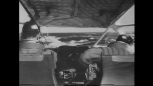 Heathley (James Donald) loses control of the plane during the fight in Anthony Asquith's The Net (1953)