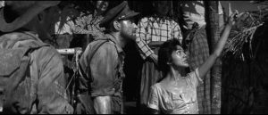 The Burmese villagers are initially welcoming in Val Guest's Yesterday's Enemy (1959)