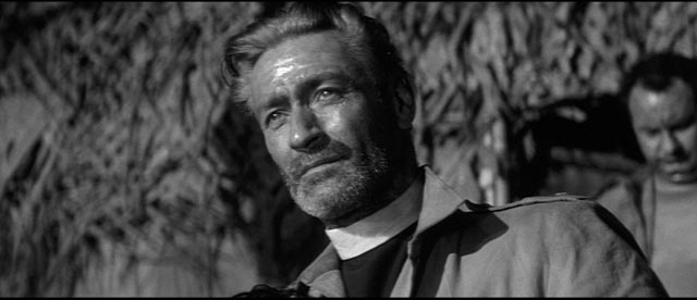 Guy Rolfe as the Chaplain whose moral clarity is shaken by the reality of war in Val Guest's Yesterday's Enemy (1959)