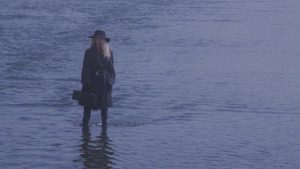 A mysterious woman stalks serial killer Dennis Skinner in Ivan Nagy's Skinner (1993)