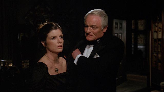 Charles Gray tries to charm a perplexed Katherine Ross in Richard Marquand's The Legacy (1978)
