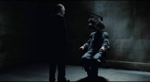 O'Brien (Richard Burton) shows no animosity towards Winston Smith (John Hurt) as he tortures him in Michael Radford's 1984 (1984)