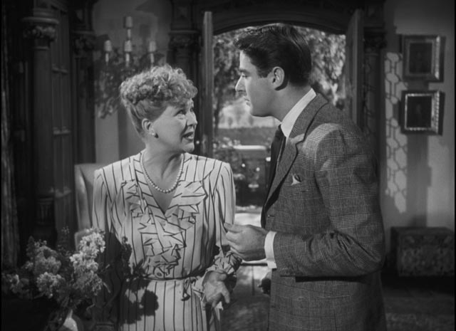 Feckless Andrew Carmel (Peter Lawford) tells his Mother (Margaret Bannerman) to expect the arrival of refugee Adam Belinski (Charles Boyer) in Ernst Lubitsch's Cluny Brown (1946)