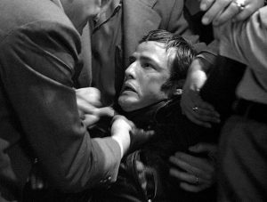 The good townsfolk get rough with Johnny (Marlon Brando) in Laslo Benedek's The Wild One (1970)