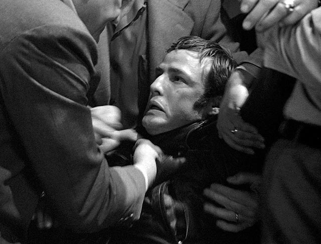 The good townsfolk get rough with Johnny (Marlon Brando) in Laslo Benedek's The Wild One (1970)