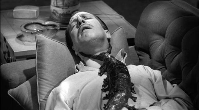 Dr. Chapin (Vincent Price) falls prey to the critter once he's set it free in William Castle's The Tingler (1959)