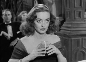 Margot (Bette Davis) cedes the spotlight to Eve (Anne Baxter) at the Sarah Siddons Society awards banquet in Joseph L. Mankiewicz's All About Eve (1950)