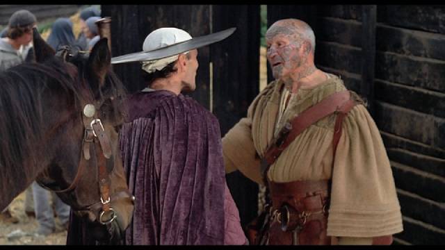 Chaucer (Pier Paolo Pasolini) chats with one of the pilgrims in Pier Paolo Pasolini's The Canterbury Tales (1972)