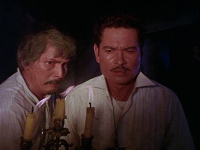 Eduardo (Eddie Garcia) is shown the family secret by his father (Johnny Monteiro) in Gerardo De Leon's Curse of the Vampires (1966)