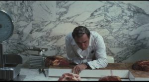 The Butcher (Ugo Tognazzi) rules over his domain with arrogant dishonesty in Elio Petri's Property Is No Longer a Theft (1973)