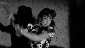 Lucy (Joan Crawford)'s history of axe-murdering casts suspicion on her in William Castle's Strait-Jacket (1964)
