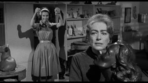 Lucy Harbin (Joan Crawford) is insecure with her estranged daughter Carol (Diane Baker) in William Castle's Strait-Jacket (1964)