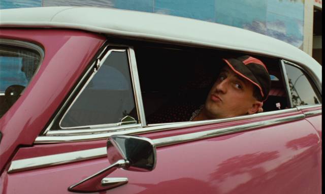 Chico (Chick Ortega) enjoys the material benefits of the U.S. in San Francisco in Wim Wenders' Until the End of the World (1991)