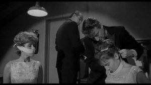 Russian agents resort to kidnapping in their attempts to get hold of the coin in William Castle's Zotz! (1962)
