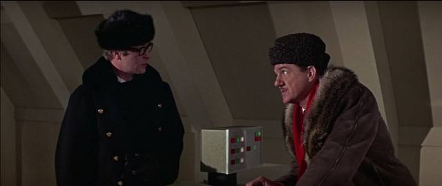 Harry and Leo Newbigen (Karl Malden) consult with the Brain's remote terminal in Ken Russell's Billion Dollar Brain (1967)