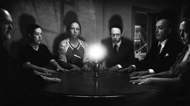 A seance under the guidance of psychic investigator Harry Price tries to contact the ghosts in Ashley Thorpe's Borley Rectory (2017)