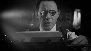 V.C. Wall (Reece Shearsmith) writes an article for the Daily Mirror in Ashley Thorpe's Borley Rectory (2017)