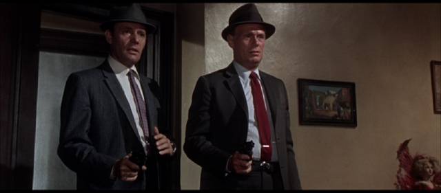 Madigan (Richard Widmark) and his partner Rocco Bonaro (Harry Guardino) drop in on a suspect in Don Siegel's Madigan (1968)