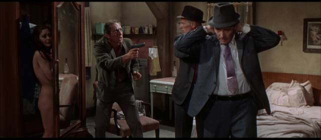 Killer Barney Benesh (Steve Ihnat) gets the drop on Madigan (Richard Widmark) and his partner Rocco Bonaro (Harry Guardino) in Don Siegel's Madigan (1968)