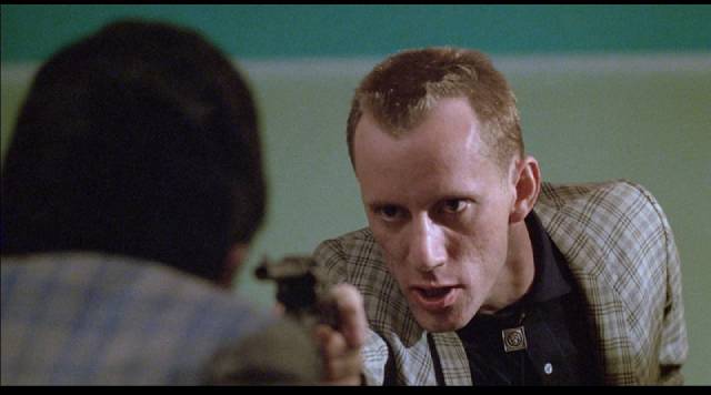 Petty thief Gregory Powell (James Woods) has a hair-trigger temper in Harold Becker's The Onion Field (1979)