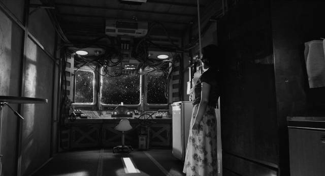 Robot courier Yoko Suzuki (Megumi Kagurazaka) waits patiently between stops in Sion Sono's The Whispering Star (2015)