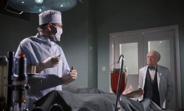 Dr. Peter Blood (Kieron Moore) pushes research beyond acceptable limits in Sidney J. Furie's Doctor Blood's Coffin (1961)
