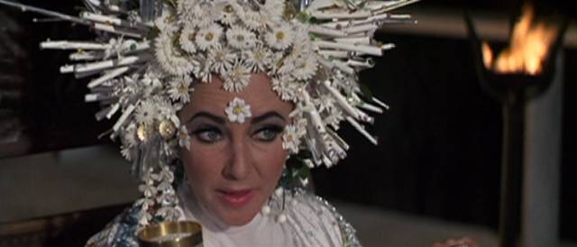 Liz Taylor as wealthy widow Sissy Goforth clinging to life in Joseph Losey's Boom (1968)