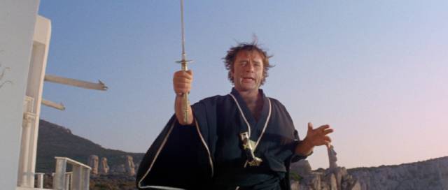 Flanders (Richard Burton) waves his katana around like an amateur bringer of death in Joseph Losey's Boom (1968)