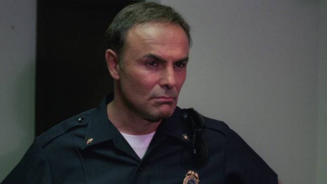 John Saxon, the slasher aficionado's go-to small-town sheriff in Sergio Martino's Nightmare Beach (1988)