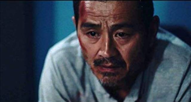Lao Shi (Gang Chen)'s life inexorably falls apart in Johnny Ma's Old Stone (2016)