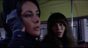 Cenci (Mia Farrow) approaches Leonora (Liz Taylor) on a London bus in Joseph Losey's Secret Ceremony (1968)