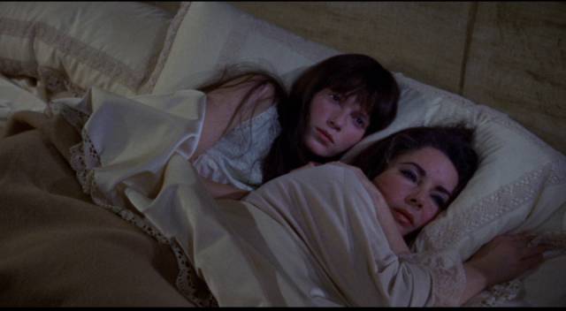 Cenci (Mia Farrow) and Leonora (Elizabeth Taylor) seek mutual comfort to ease their individual grief in Joseph Losey's Secret Ceremony (1968)