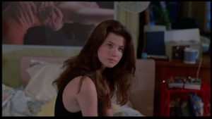 Daphne Zuniga as Kelly, whose past conceals a deadly secret in Larry Stewart's The Initiation (1984)