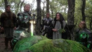 Frustrated knights try to pull the sword from the stone in John Boorman's Excalibur (1981)