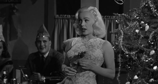 Mamie Van Doren entertains a Christmas party in Edward L. Cahn's Guns, Girls and Gangsters (1958)