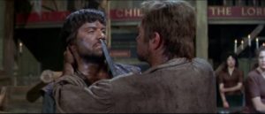 Brocaire (Oliver Reed) gets into a fight over a woman in John Gilling's The Pirates of Blood River (1962)