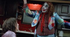 Tiny Tim as Mervo tries to entertain Jill (Itonia Salchek) in Bill Rebane's Bloody Harvest (1986)