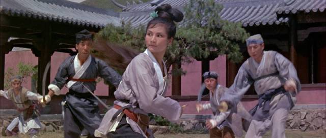 Golden Swallow (Cheng Pei-pei) fights the bandits on temple grounds in King Hu's Come Drink With Me (1966)