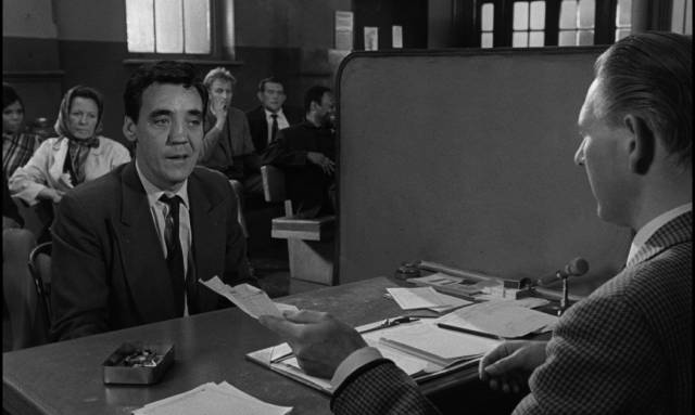 An atmosphere of distrust permeates the social assistance office in Bryan Forbes' The Whisperers (1967)